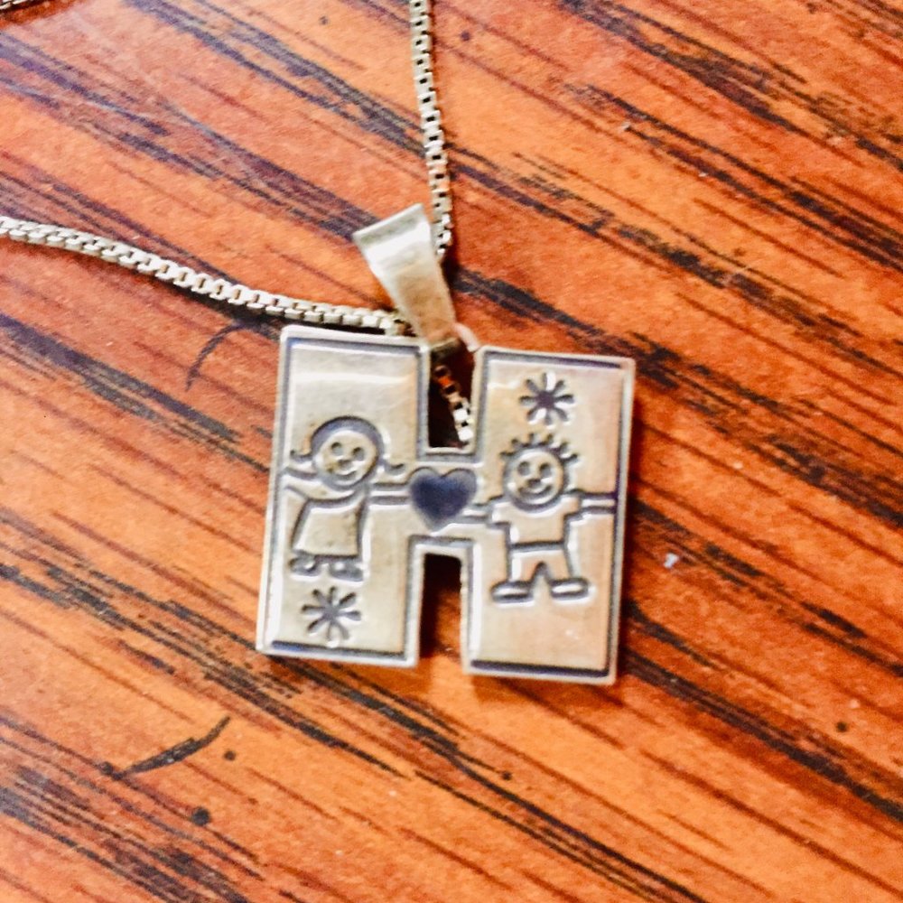 Vintage sterling silver pendant with H charm